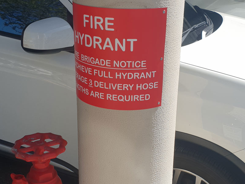 fire hydrant sticker on concrete pole